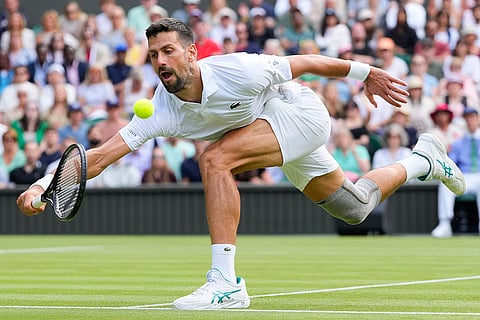 Serbia's Novak Djokovic plays a return